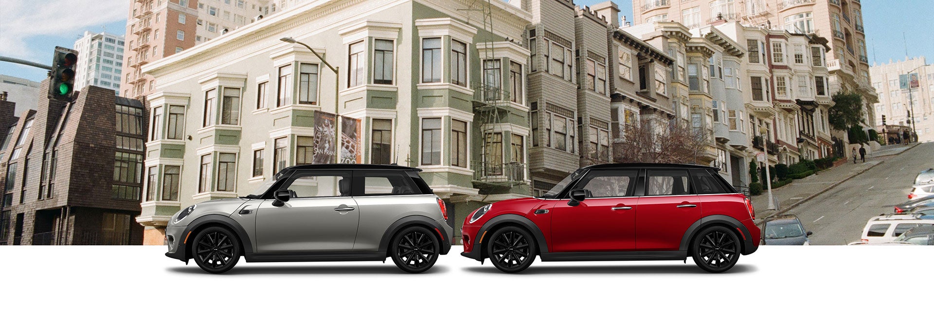 Grey Oxford Edition MINI  Cooper 2 Door Hardtop  and Red Oxford Edition MINI  Cooper 4 Door Hardtop  in front of cityscape | MINI of Alexandria in Alexandria VA