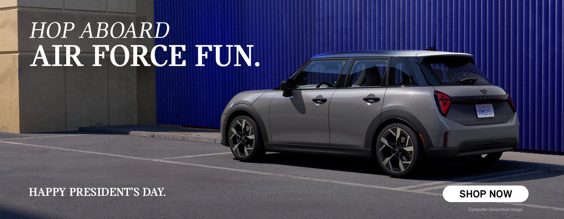 side view of grey cooper infront of blue wall.